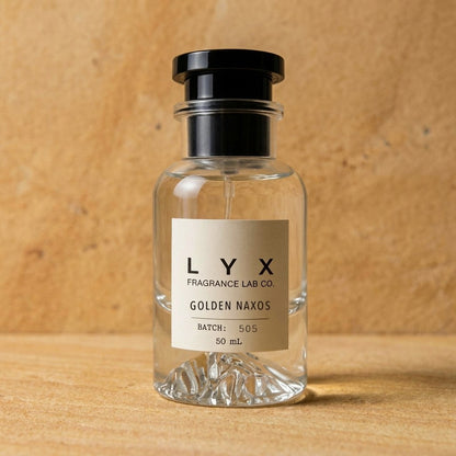 Golden Naxos 505 – LYX bottle on honey sandstone